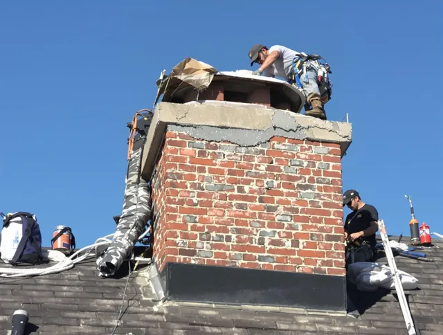 Compton Chimney Sweep installing a custom chimney crown in Compton, CA