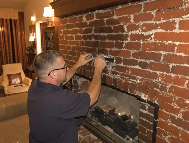 Compton Chimney Sweep expert fixing a fireplace in Compton, CA